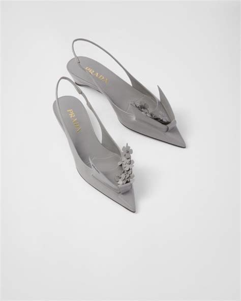 prada brushed leather pumps with floral appliqués|Brushed leather slingback pumps with floral appliques.